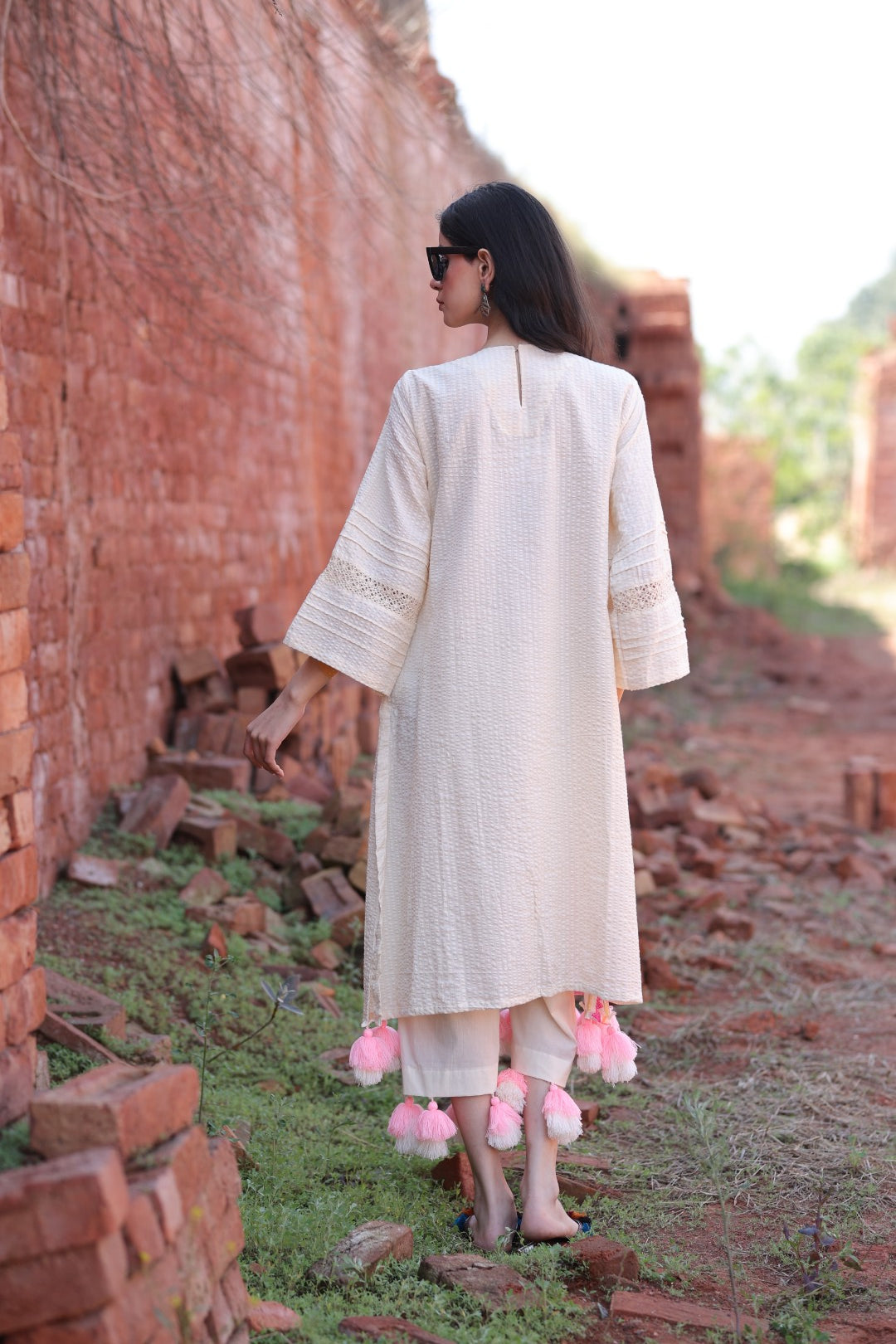 Flowing silhouette with layered tassels, evoking a dreamy, carefree vibe.