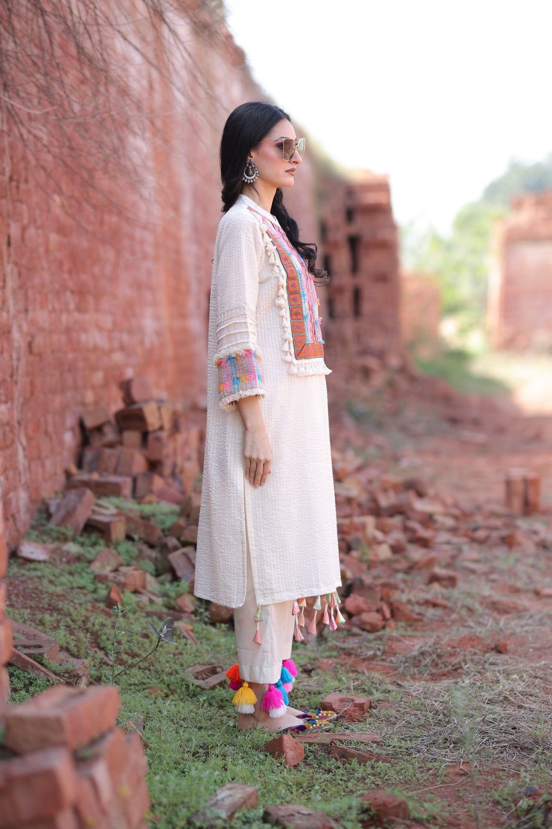 Sun-kissed right view highlighting earring and sunglasses styling.