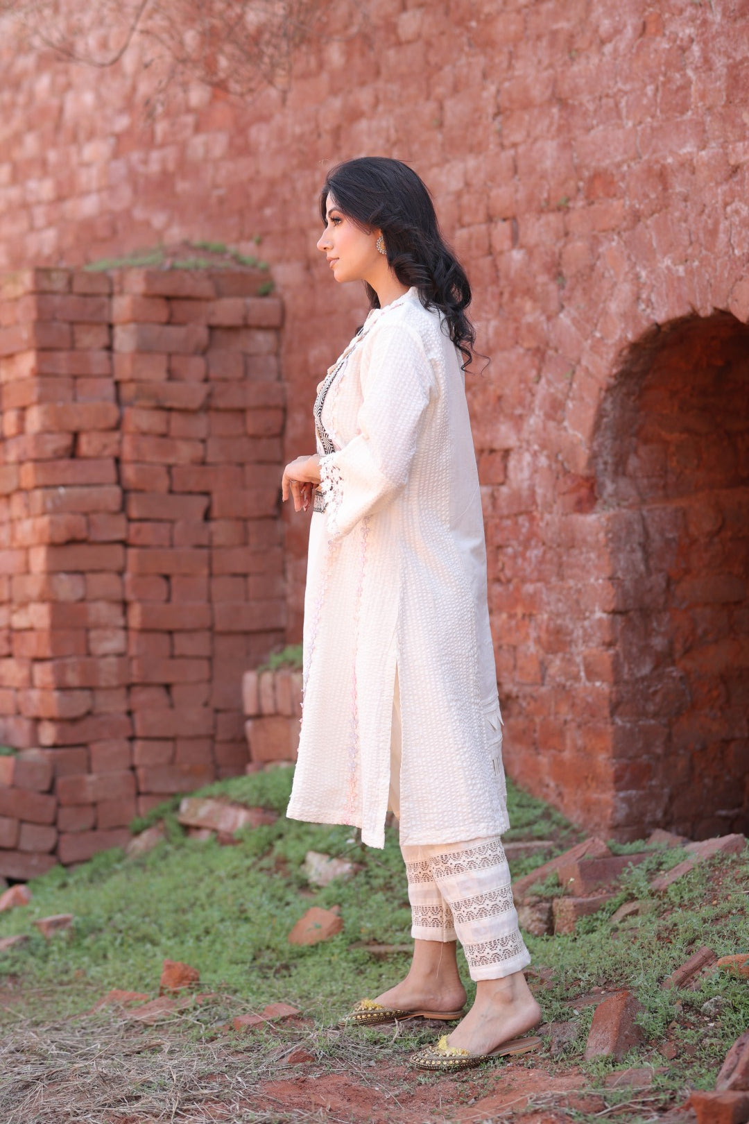 Side angle showcasing tassel detailing and flowy silhouette