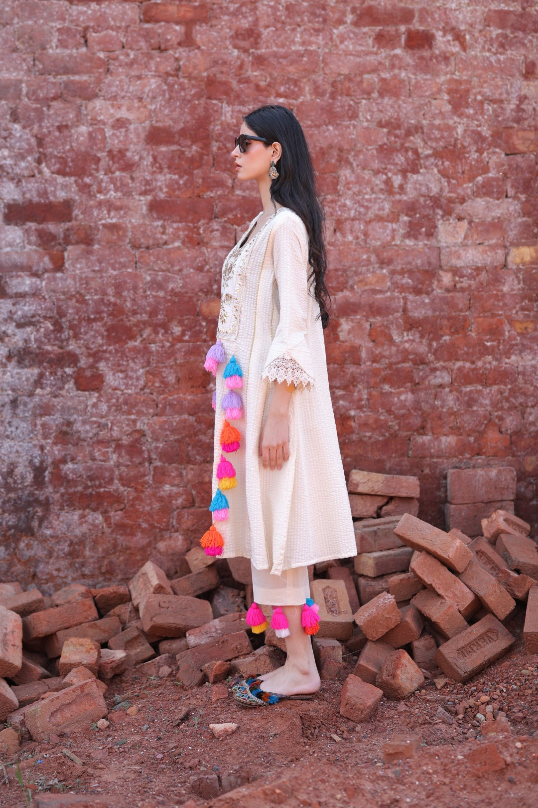 Side view highlighting tassel play and sleeve detail