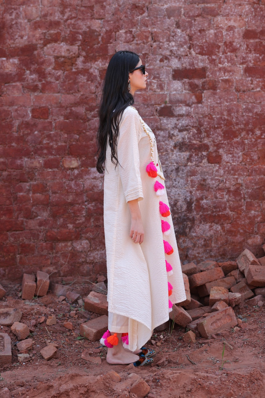 Right angle showcasing embroidered yoke and flared sleeve.