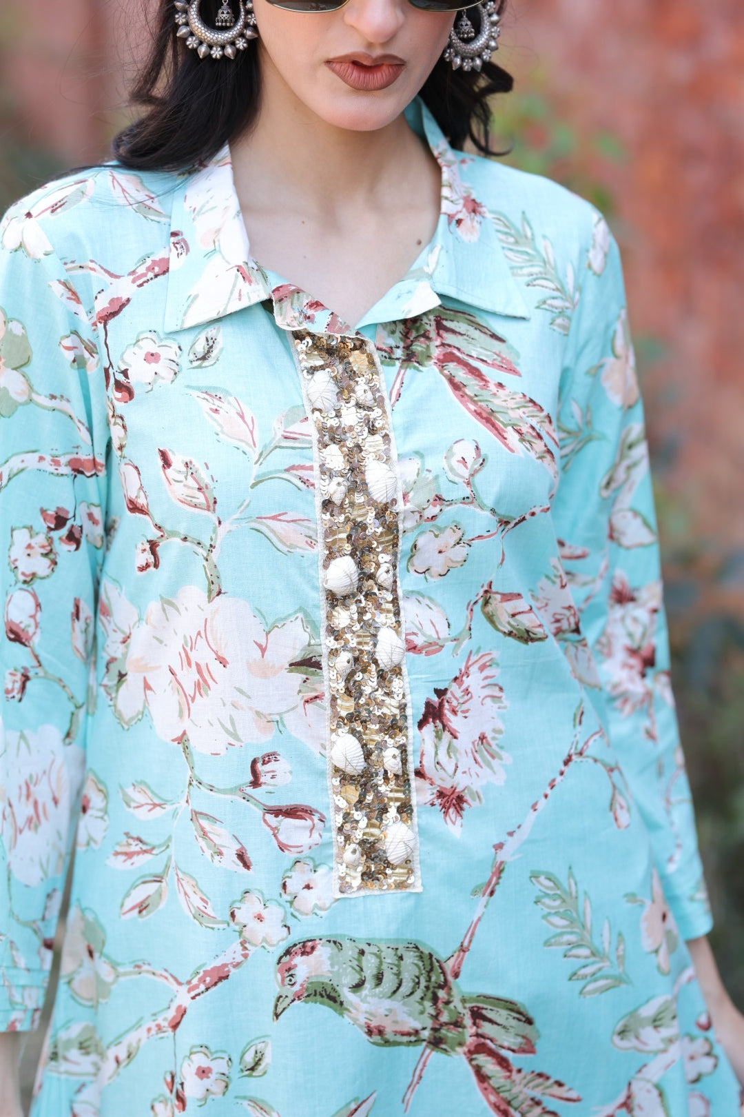 Close-up of multicolour handcrafted tassels and sequin embroidery