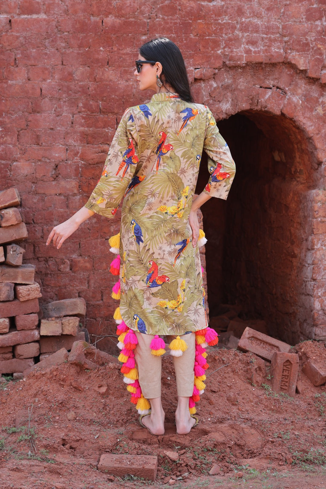 Back view highlighting tassels and kurta silhouette