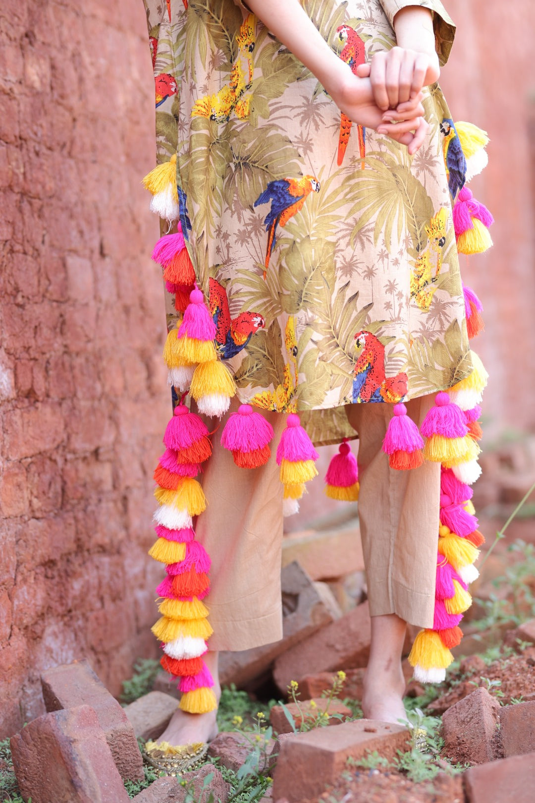 Close-up of mirror embroidery and tassel craftsmanship