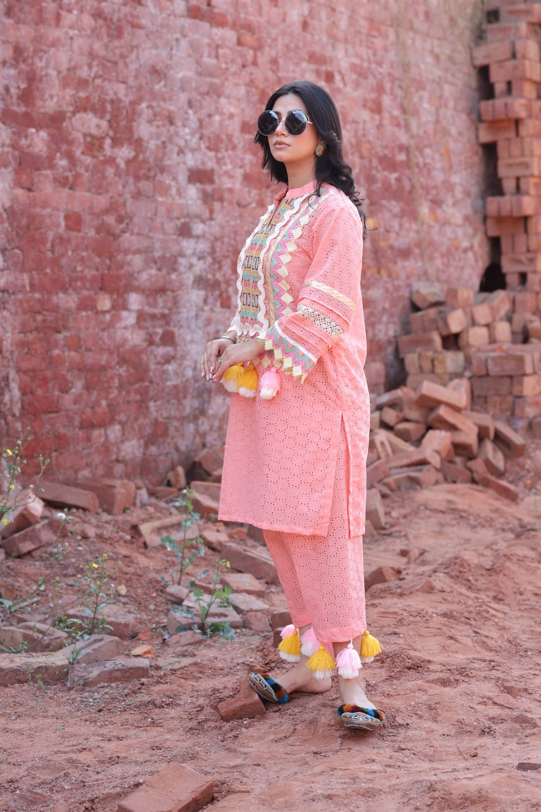Side profile showing sleeve detail and mirror embroidery