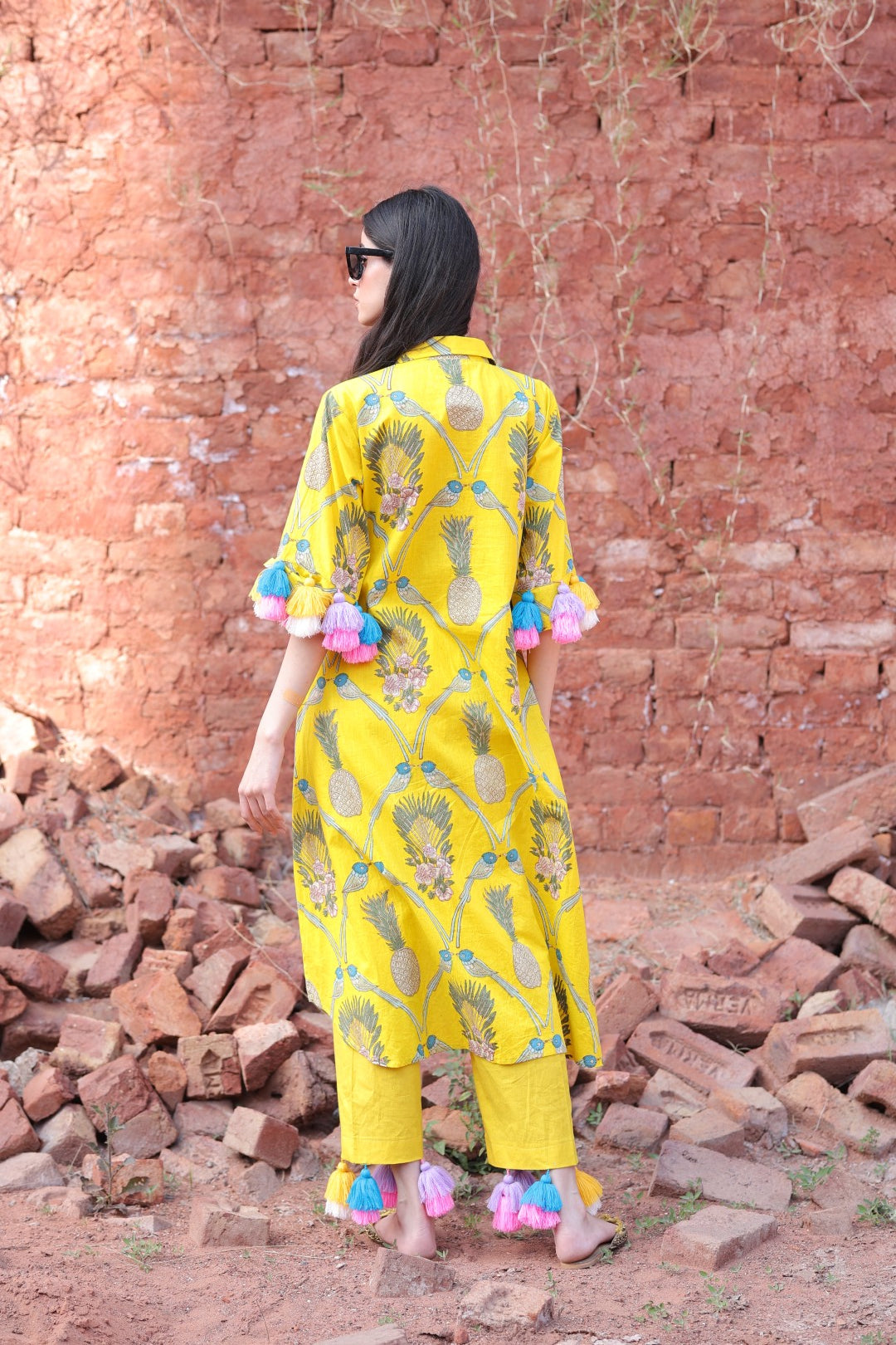 Backside showcasing tassels and kurta fall