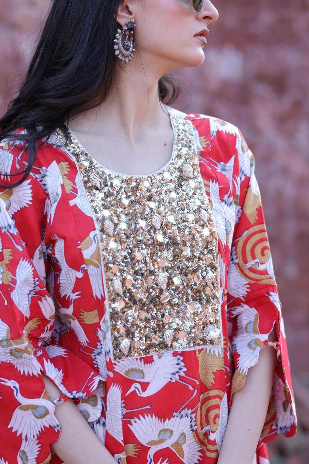 Close-up of mirror embroidery and handcrafted tassels