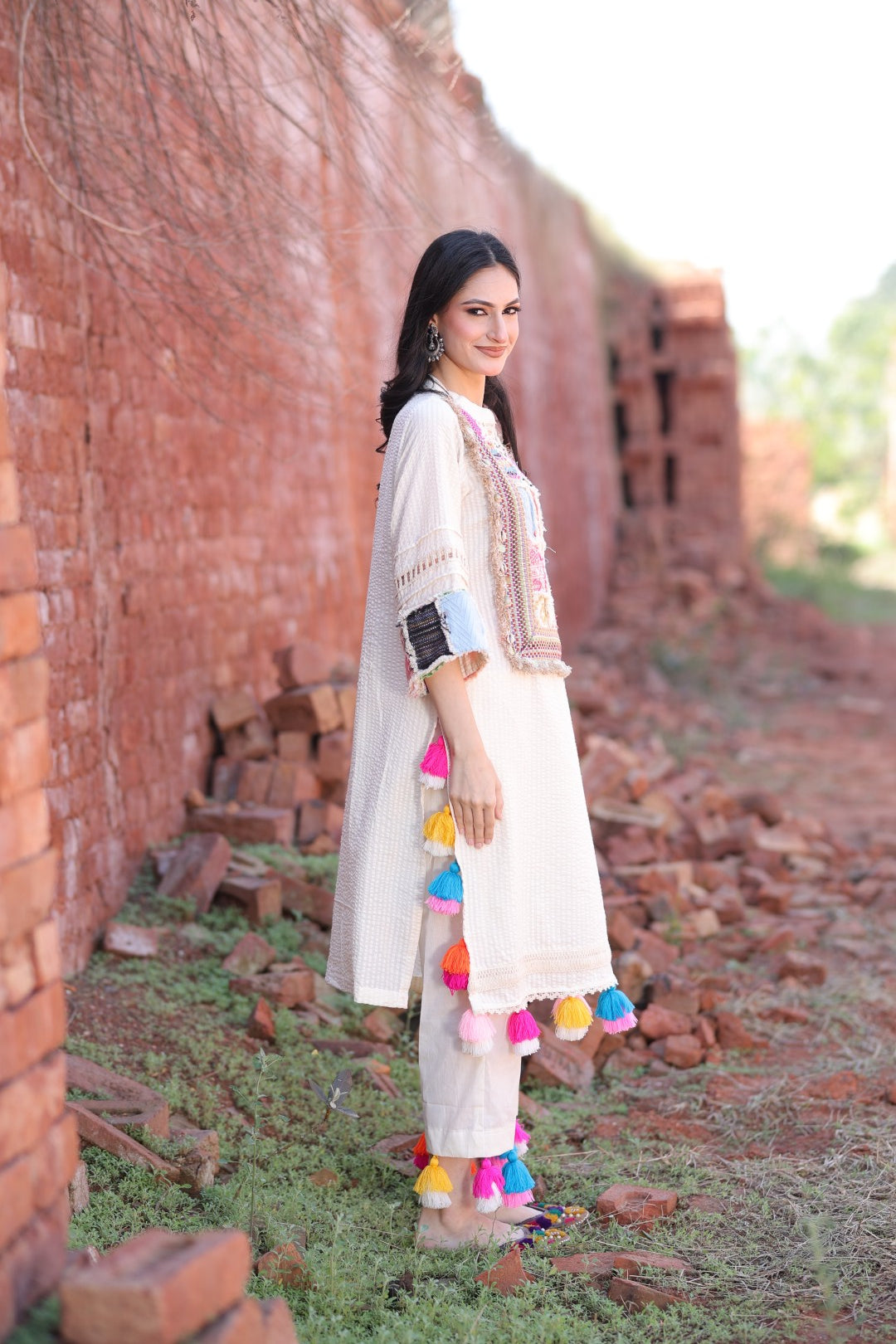 Right side view of kurta in textured cotton with subtle ladder lace