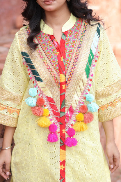Close-up of tassels, embroidered yoke and mirror patchwork