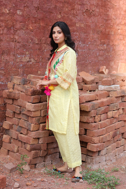 Side profile showcasing sleeve detailing and tassels