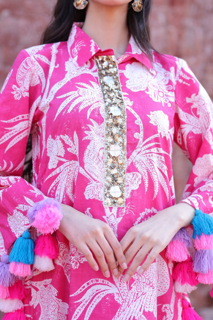 Close-up of mirror placket, tropical print and tassel craftsmanship